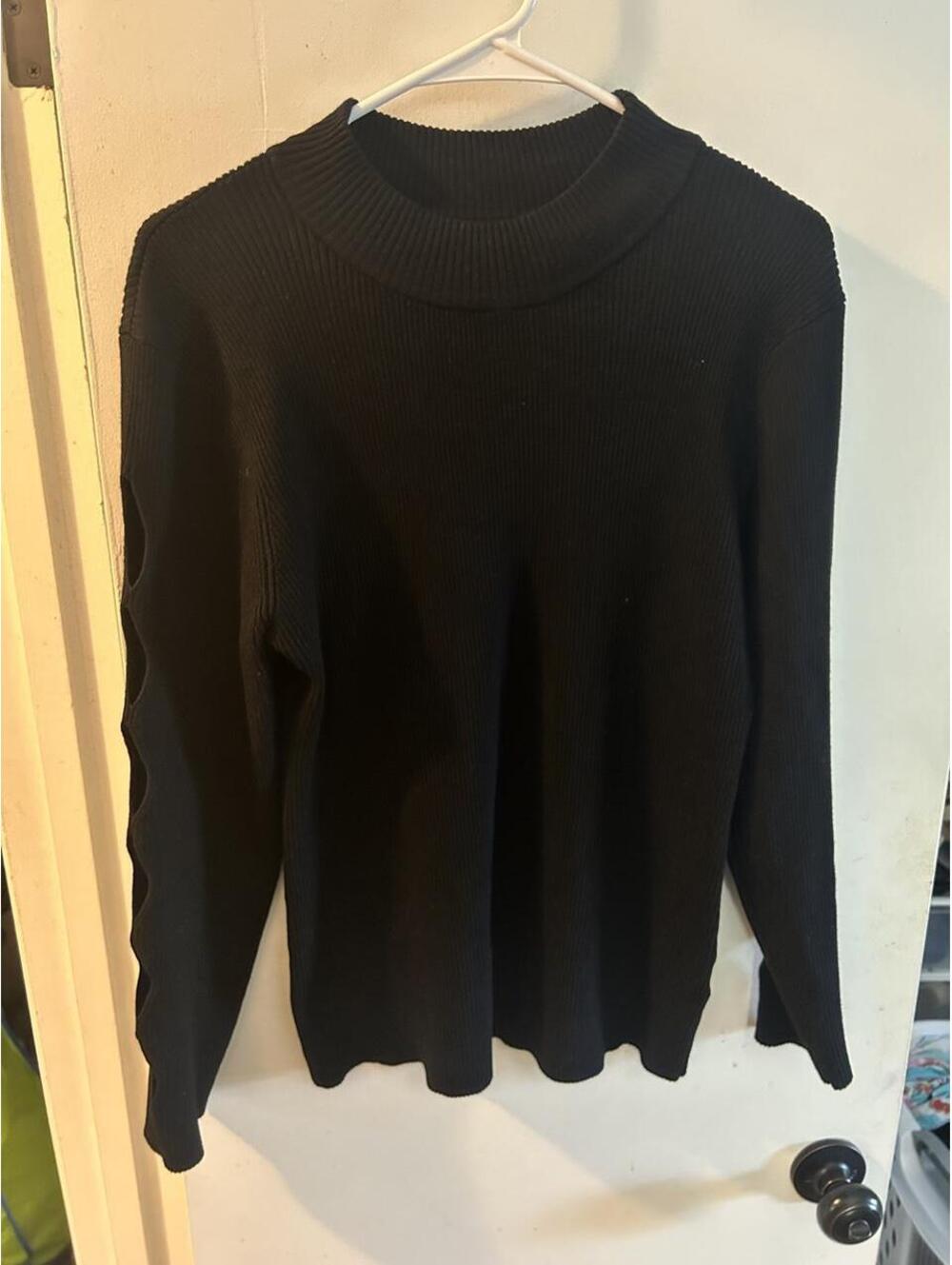 Almost Famous black sweater with diamond shaped cutout sleeves in a 3X